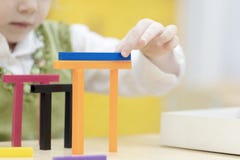 A little girl builds a house from the designer stock images A little girl builds a house from the designer stock images