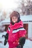 Toddler Boy Wearing Red and Black Winter Jacket and Gray Ushanka Hat Standing on Snow Covered Field Stock Photo Toddler Boy Wearing Red and Black Winter Jacket and Gray Ushanka Hat Standing on Snow Covered Field Stock Photo