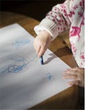 Toddler Drawing With Crayons Royalty Free Stock Photos