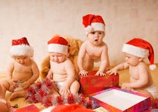 Toddlers in Christmas hats