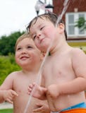 Toddlers having fun in fountain stock image Toddlers having fun in fountain stock image