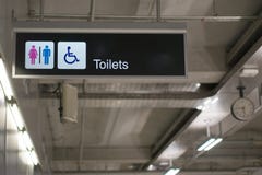 Toilets information board sign at international airport terminal Royalty Free Stock Photo Toilets information board sign at international airport terminal Royalty Free Stock Photo