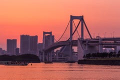 Tokyo skyline and rainbow bridge at sunset in Odaiba waterfront. stock photography Tokyo skyline and rainbow bridge at sunset in Odaiba waterfront. stock photography