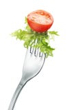 Tomato and lettuce on fork