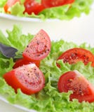 Tomato Slices On Lettuce Leaves. Royalty Free Stock Photos