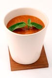Tomatoe soup with basil in white cup