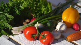 Tomatoes and other vegetables in a wooden box royalty free stock image Tomatoes and other vegetables in a wooden box royalty free stock image