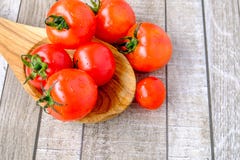 Tomatoes on a wooden spoon royalty free stock photography Tomatoes on a wooden spoon royalty free stock photography