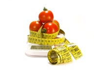 Tomatos And Tape Measure Isolated Stock Images