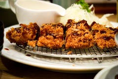 Tonkutsu. Japanese fired chicken serve with salads and sauce royalty free stock images Tonkutsu. Japanese fired chicken serve with salads and sauce royalty free stock images