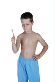 Toothbrush novo da terra arrendada do menino e factura de uma face imagem de stock Toothbrush novo da terra arrendada do menino e factura de uma face imagem de stock