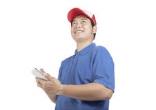 Toothy smiling face of delivery man and smart computer in hand p royalty free stock photos Toothy smiling face of delivery man and smart computer in hand p royalty free stock photos