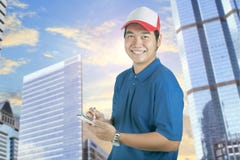 Toothy smiling face of delivery man and smart computer in hand p royalty free stock image Toothy smiling face of delivery man and smart computer in hand p royalty free stock image