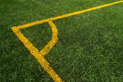 A top down angle view of yellow line on a green soccer field stock photos A top down angle view of yellow line on a green soccer field stock photos