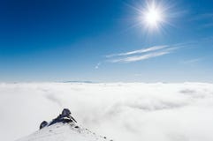 Top of the mountain covered with snow, fog, ice and amazing sky and sun royalty free stock photo Top of the mountain covered with snow, fog, ice and amazing sky and sun royalty free stock photo