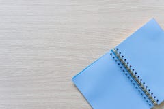 Top view of Blank blue notebook on wood background with copy space royalty free stock images Top view of Blank blue notebook on wood background with copy space royalty free stock images