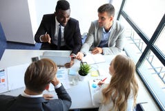 Top view of business people working together while spending time in the office. stock images Top view of business people working together while spending time in the office. stock images