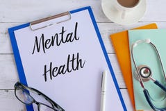 Top view of coffee,books,stethoscope,glasses,pen,clipboard, and paper written with Mental Health stock image Top view of coffee,books,stethoscope,glasses,pen,clipboard, and paper written with Mental Health stock image