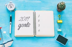 Top view 2019 goals list with notebook over wooden desk. royalty free stock photography Top view 2019 goals list with notebook over wooden desk. royalty free stock photography