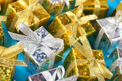Top view of golden and silver gifts close-up on a blue royalty free stock photo Top view of golden and silver gifts close-up on a blue royalty free stock photo
