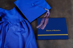 Top view of graduation mortarboard and certificate graduation on dark background, education concept royalty free stock images Top view of graduation mortarboard and certificate graduation on dark background, education concept royalty free stock images