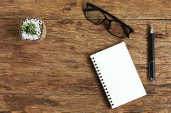 Top view image glasses of open notebook with pen on wooden table royalty free stock photos Top view image glasses of open notebook with pen on wooden table royalty free stock photos