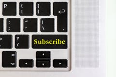 Top view isolated laptop keyboard with yellow `subscribe` text on button, concept design v stock photos Top view isolated laptop keyboard with yellow `subscribe` text on button, concept design v stock photos