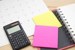 Top view notebook ,calculator,post it note and calendar put on w stock image Top view notebook ,calculator,post it note and calendar put on w stock image