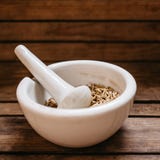 top view of oat grains in the porcelain mortar bowl on the old wooden table stock image top view of oat grains in the porcelain mortar bowl on the old wooden table stock image