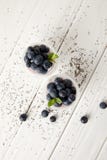 Top View Of Arranged Chia Puddings With Fresh Blueberries And Mint On White Wooden Surface Royalty Free Stock Photography