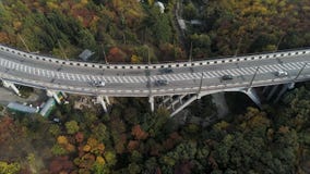 Top view on overpass with driving cars, sea and beautiful landscape background. Aerial view of highway and overpass in stock photos Top view on overpass with driving cars, sea and beautiful landscape background. Aerial view of highway and overpass in stock photos