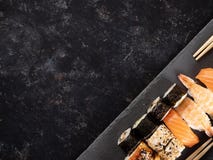 Top view plate of sushi on dark stone royalty free stock images Top view plate of sushi on dark stone royalty free stock images