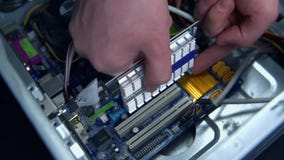 Top view of removing graphic card from PC. Hand in close up removing electronic element from personal computer in slow motion Top view of removing graphic card from PC. Hand in close up removing electronic element from personal computer in slow motion