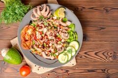 Top view of salad with tentacles of octopus, lime, avocado and l royalty free stock photography Top view of salad with tentacles of octopus, lime, avocado and l royalty free stock photography