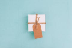 Top view of a small gift box with a label stock photo Top view of a small gift box with a label stock photo