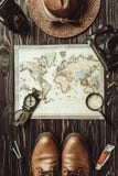 top view of travel setting with straw hat, map, shoes, compass, magnifying glass and photo cameras on dark royalty free stock photography top view of travel setting with straw hat, map, shoes, compass, magnifying glass and photo cameras on dark royalty free stock photography
