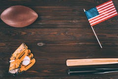 top view of us flag, rugby ball, baseball bats and glove with ball royalty free stock photos top view of us flag, rugby ball, baseball bats and glove with ball royalty free stock photos