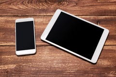Top view of white tablet blank black screen for advertisement display or other app design with smartphone royalty free stock images Top view of white tablet blank black screen for advertisement display or other app design with smartphone royalty free stock images