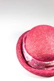 Top view of woman`s pink straw hat with scarf band, on white, copy space. Vertical aspect Stock Image Top view of woman`s pink straw hat with scarf band, on white, copy space. Vertical aspect Stock Image