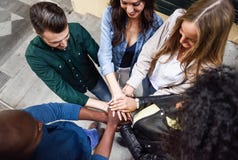 Top view of young people putting their hands together. stock photography Top view of young people putting their hands together. stock photography