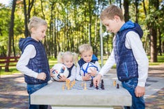The topic children learning, logical development, mind and math, miscalculation moves advance. large family brothers and sister royalty free stock photo The topic children learning, logical development, mind and math, miscalculation moves advance. large family brothers and sister royalty free stock photo