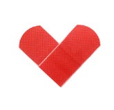 Toppa medica come simbolo del cuore isolata su bianco Fotografia Stock Toppa medica come simbolo del cuore isolata su bianco Fotografia Stock