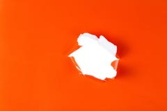 Torn orange paper hole. Tearing Inside white stock image Torn orange paper hole. Tearing Inside white stock image