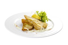 Torskfiléer med citronen och sallad arkivfoto Torskfiléer med citronen och sallad arkivfoto