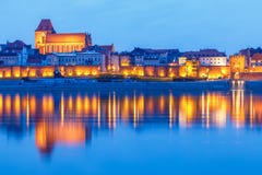 Torun at night, medieval Old Town reflected in Vistula river, Poland. Europe. royalty free stock images Torun at night, medieval Old Town reflected in Vistula river, Poland. Europe. royalty free stock images