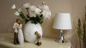 Touching Wooden figures of parents and children near a bouquet of flowers. The image in pastel tones. royalty free stock photography Touching Wooden figures of parents and children near a bouquet of flowers. The image in pastel tones. royalty free stock photography