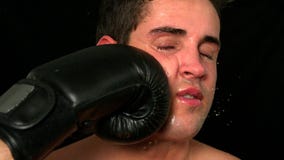 Tough boxer taking a punch to the face