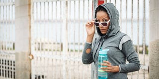 Tough looking urban fitness woman with sunglasses stock image Tough looking urban fitness woman with sunglasses stock image