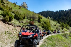 A tour group travels on ATVs and UTVs on the mountains Stock Images A tour group travels on ATVs and UTVs on the mountains Stock Images
