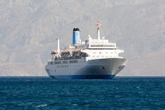 Tourist Cruise Sea Liner Is Sailing In Rocky Bay Stock Images
